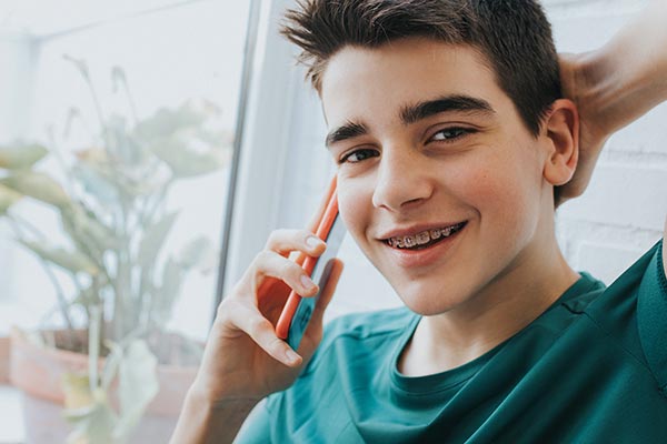 young boy smiling with tulsa braces