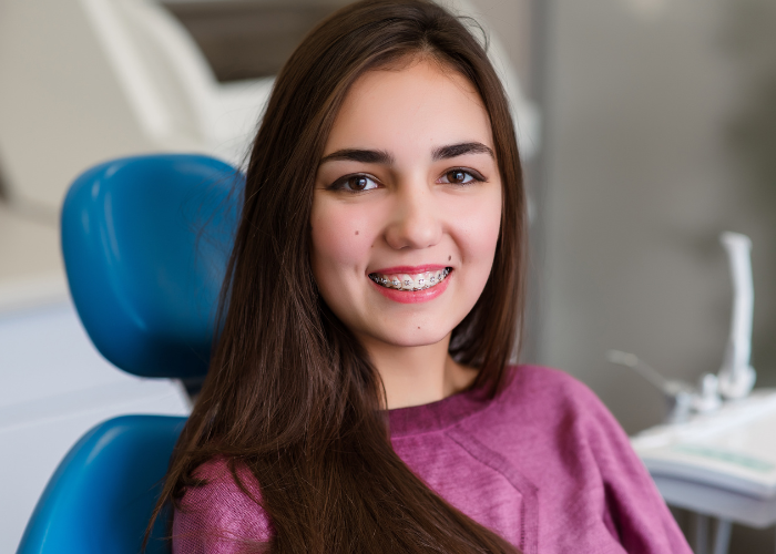 Girl With Braces On At Orthodontic Office