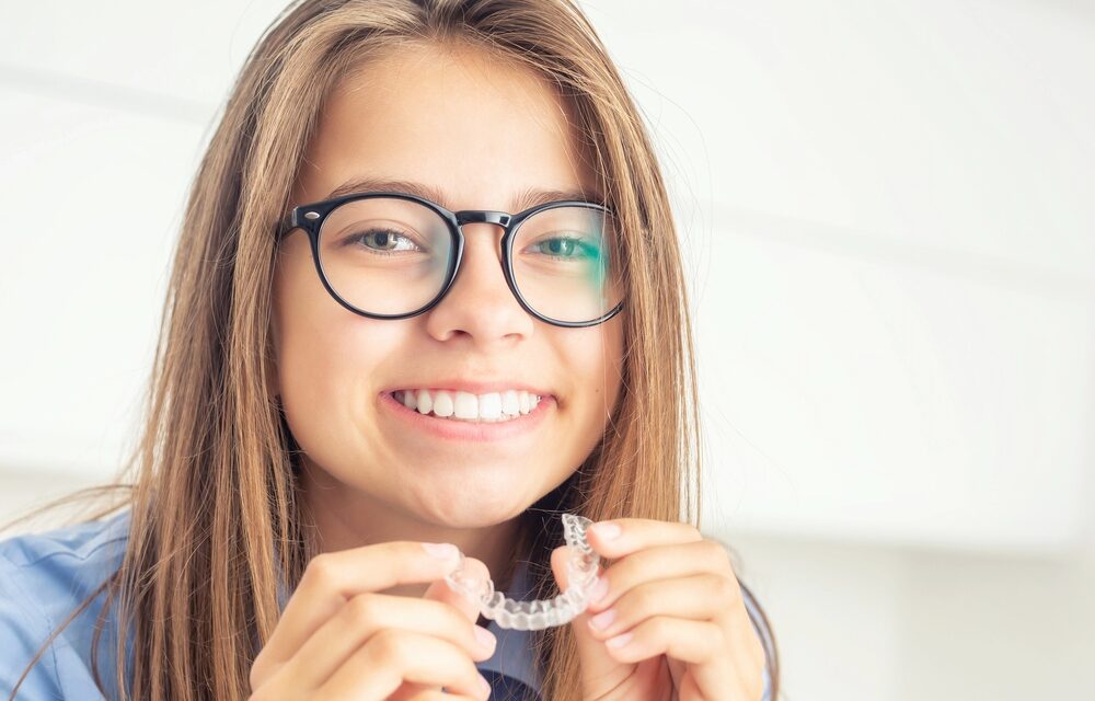young girl with dental invisalign clean aligners - Can Invisalign Fix Overbite in Tulsa, OK.