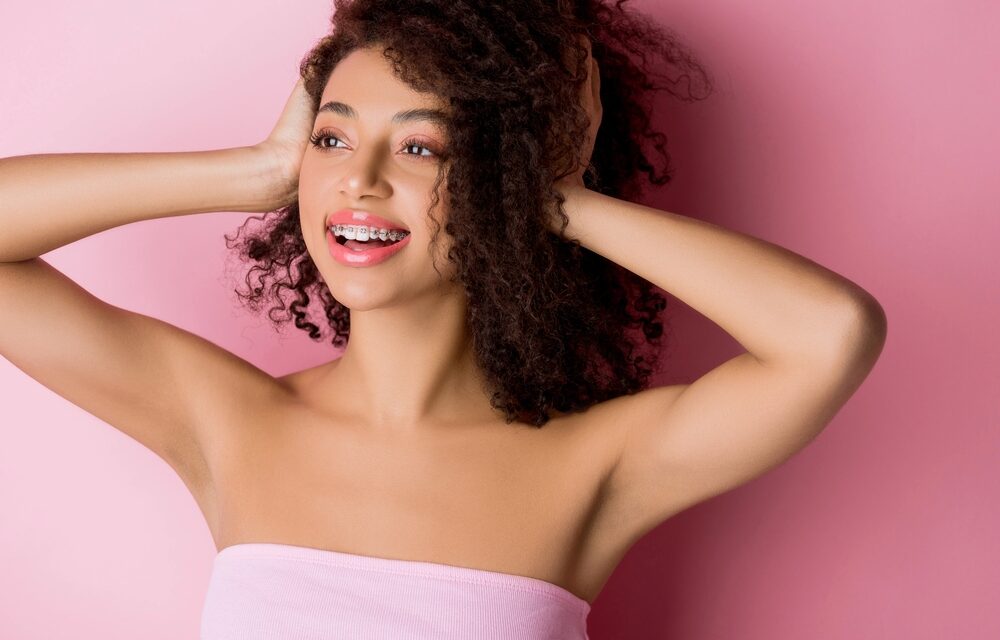 beautiful girl metal braces pink - How to Get Braces Glue Off Teeth in Tulsa, OK