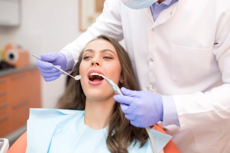 patient having dental checkup - How to Clean Braces in Tulsa, OK
